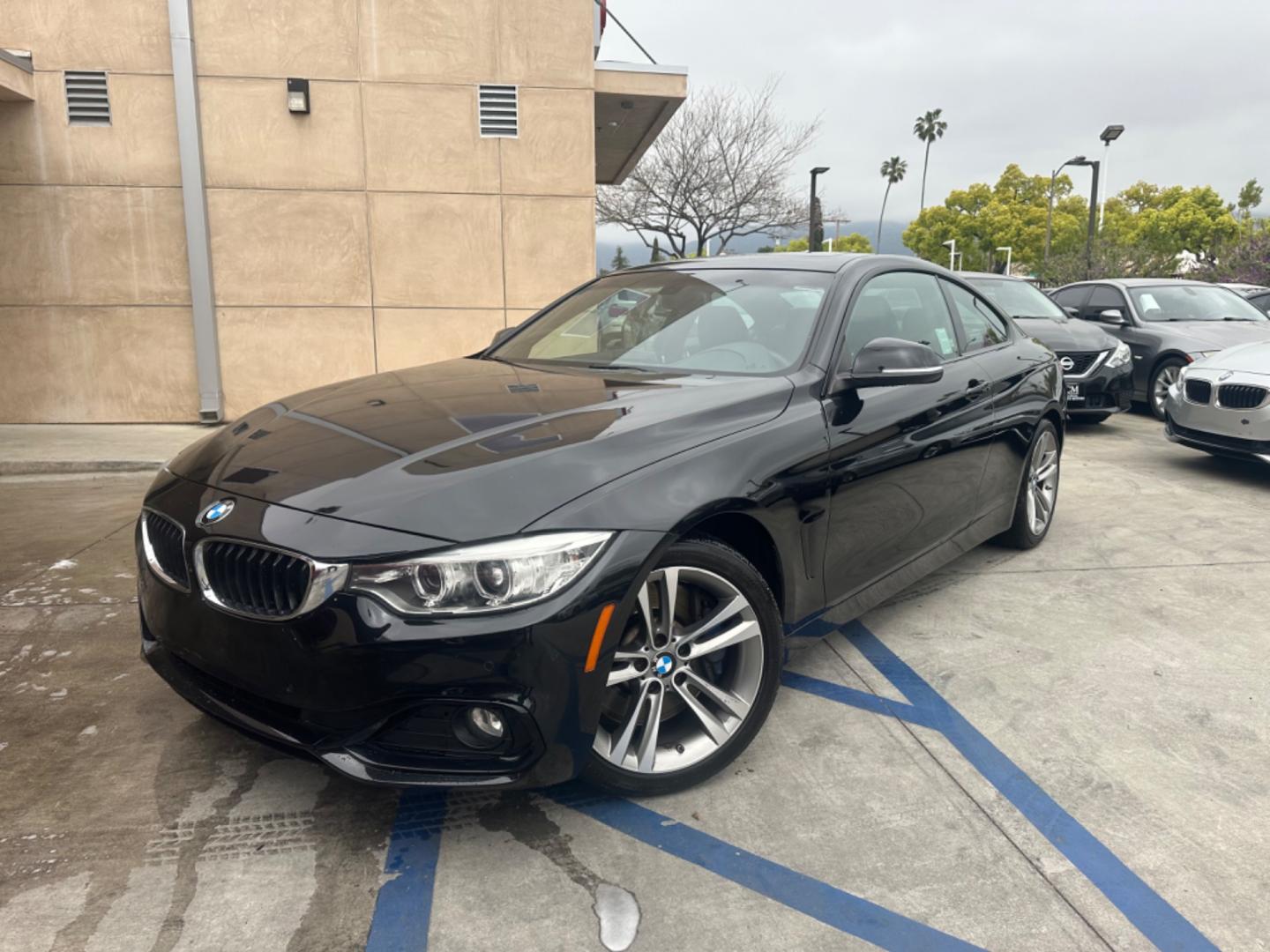 2015 Black BMW 4-Series 435i coupe (WBA3R1C55FK) with an 3.0L V6 DOHC 24V engine, 8-Speed Automatic transmission, located at 30 S. Berkeley Avenue, Pasadena, CA, 91107, (626) 248-7567, 34.145447, -118.109398 - Crown City Motors is a used “Buy Here Pay Here” car dealer in Pasadena CA. “Buy Here Pay Here” financing, means that when you purchase your vehicle from our dealership, that you make the payments to the dealership as well. We do not need the banks approval to get you approved for a used auto - Photo#0